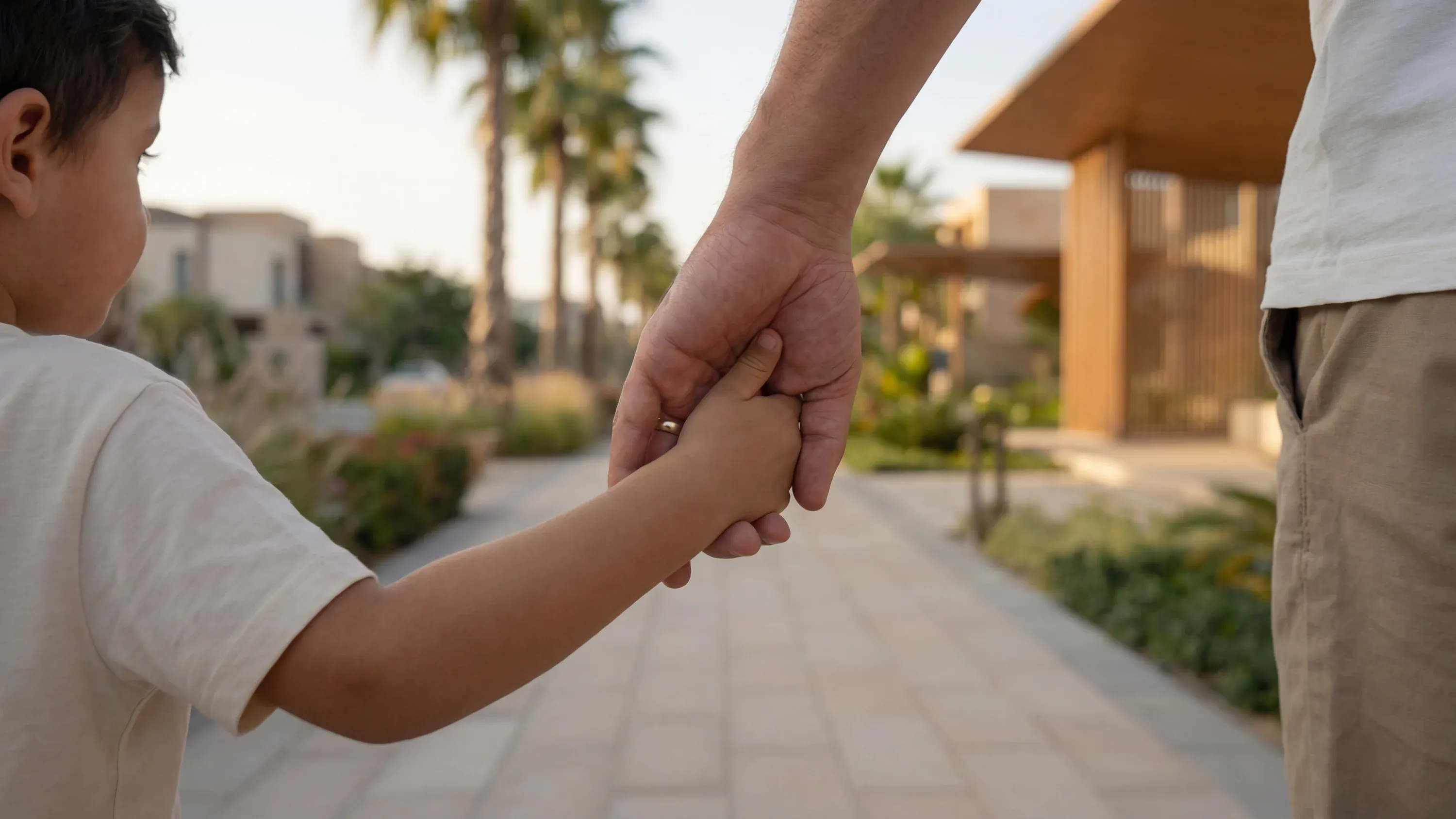 A father and child on a car-free neighbourhood walkway at Abu Dhabi Mira Hills
